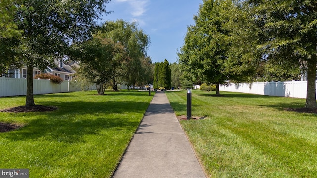 view of home's community featuring a lawn