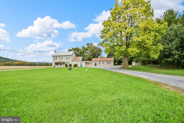 view of front of house featuring a garage and a front lawn