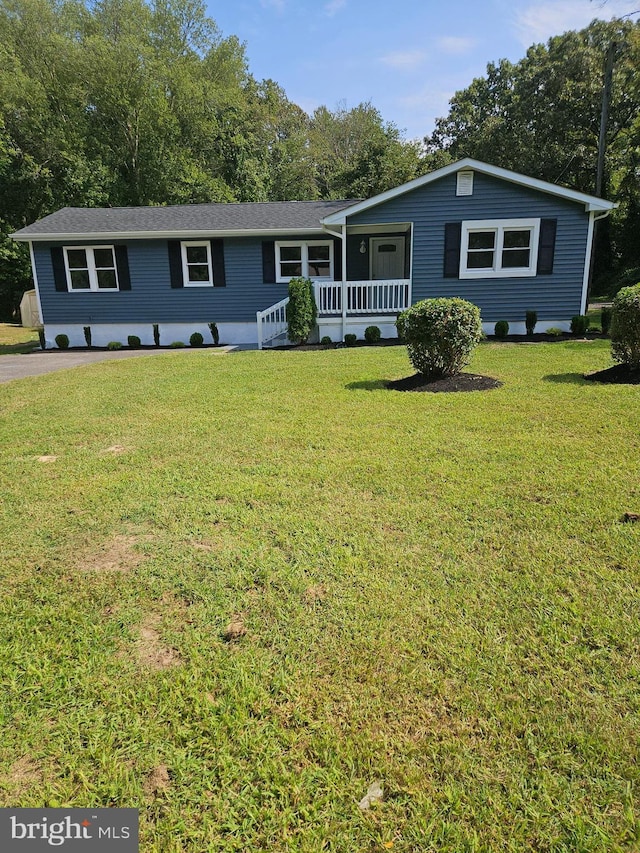 view of front of home featuring a porch and a front yard