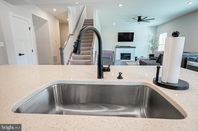 kitchen featuring decorative backsplash, stainless steel electric stove, light hardwood / wood-style floors, and white cabinetry