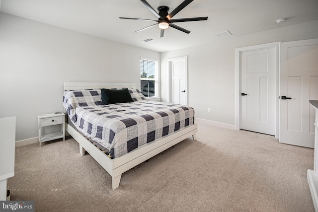 carpeted bedroom with ceiling fan