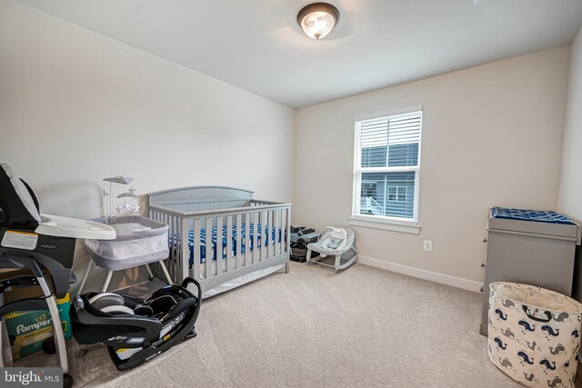 carpeted bedroom with connected bathroom and ceiling fan