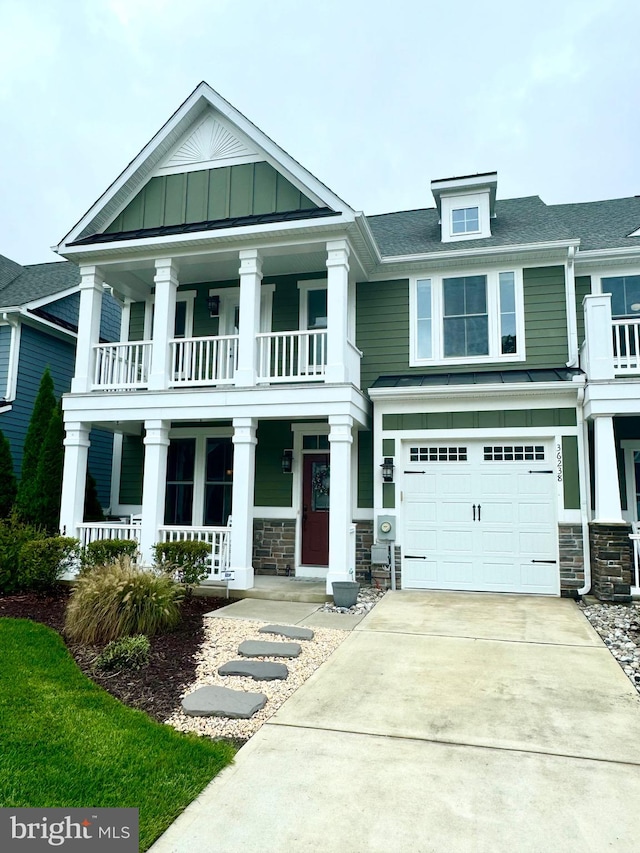 neoclassical home with covered porch and a garage