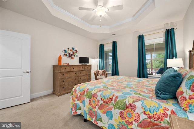 bedroom with a raised ceiling, carpet floors, access to outside, ornamental molding, and ceiling fan