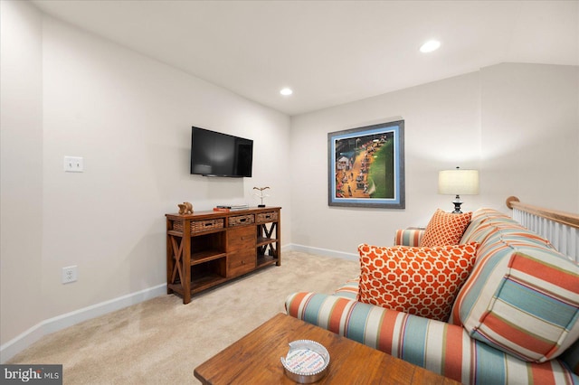 living room with vaulted ceiling and light colored carpet