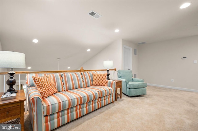 carpeted living room with lofted ceiling