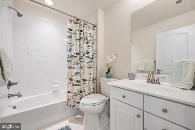 full bathroom featuring tile patterned floors, toilet, shower / bath combo with shower curtain, and vanity