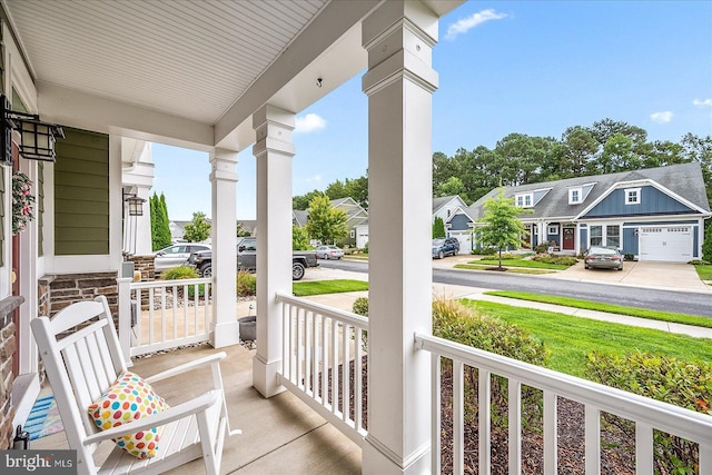 view of patio featuring a residential view and a porch