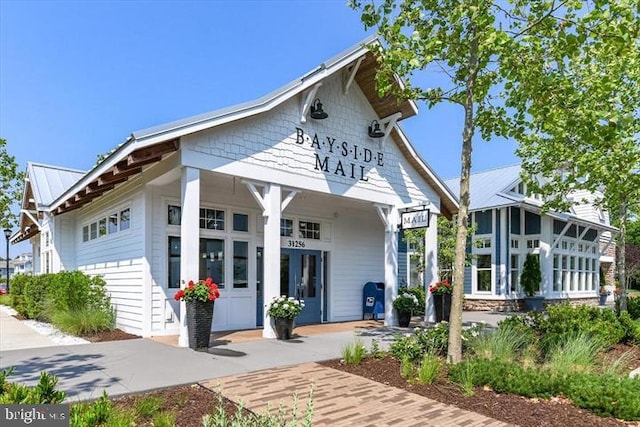 view of front of home with metal roof and french doors