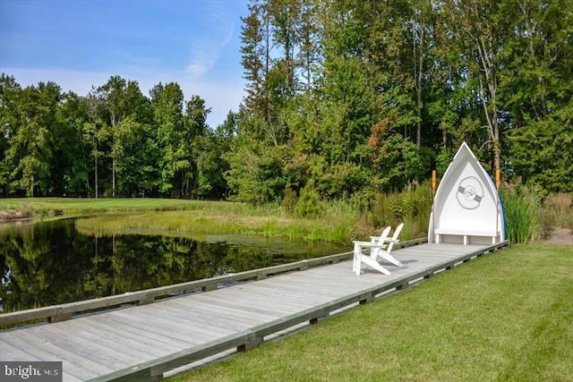 dock area featuring a yard and a water view