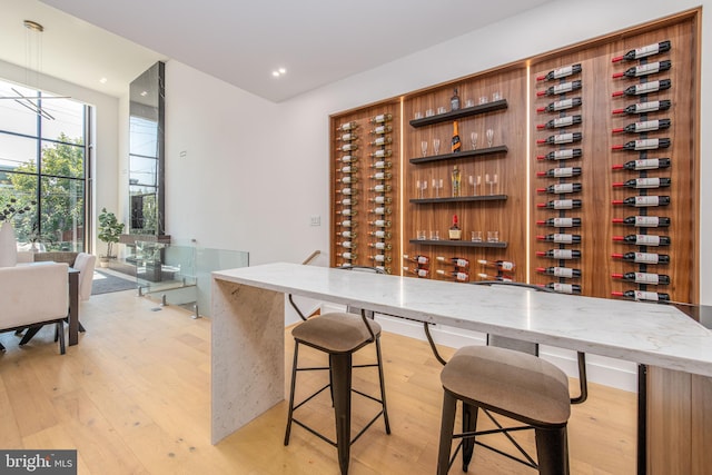 wine room with light hardwood / wood-style floors