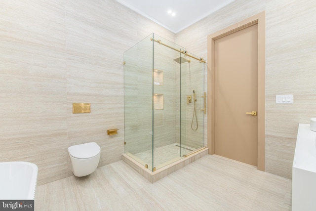 bathroom with vanity, walk in shower, tile walls, toilet, and tile patterned floors