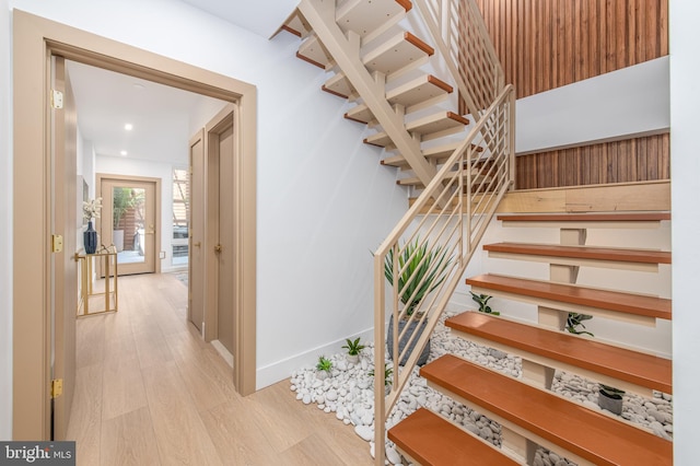 staircase featuring hardwood / wood-style floors