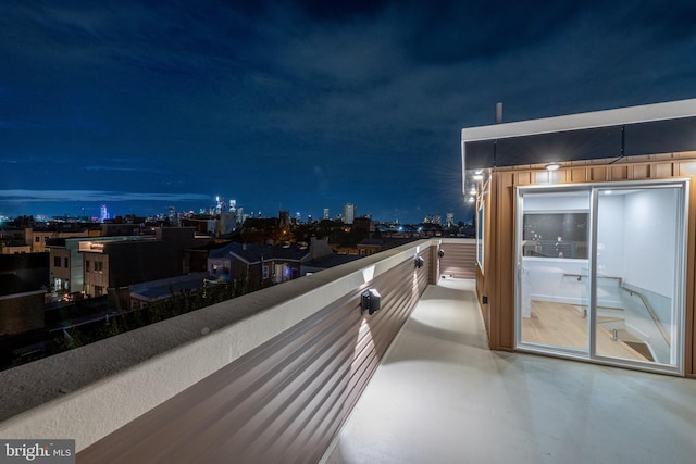 view of balcony at twilight