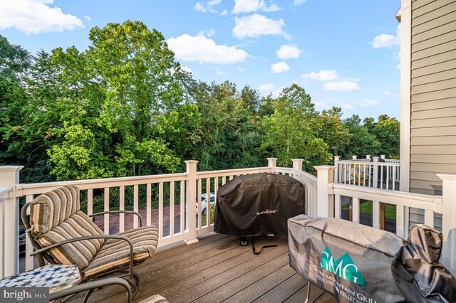 wooden deck featuring grilling area