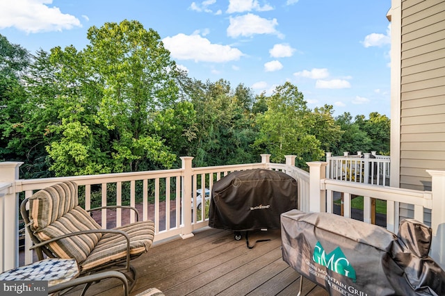 wooden deck with area for grilling