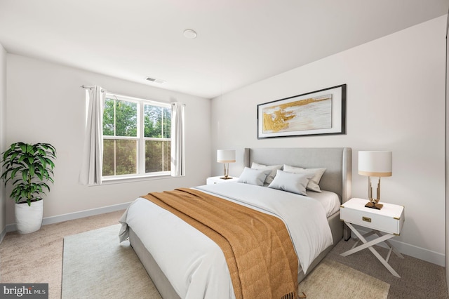 bedroom featuring carpet floors, visible vents, and baseboards