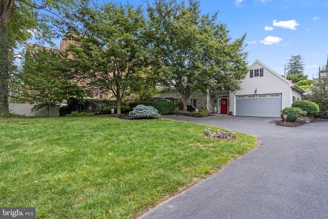 obstructed view of property featuring a front yard