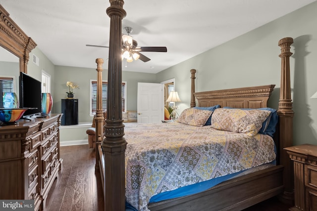 bedroom with ceiling fan and dark wood-type flooring