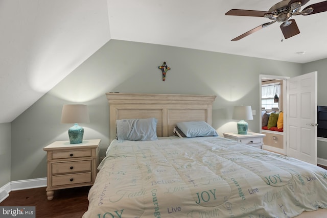 bedroom with ceiling fan, lofted ceiling, and dark hardwood / wood-style floors