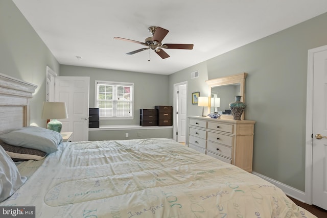 bedroom featuring ceiling fan and hardwood / wood-style flooring