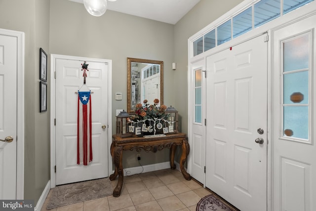 foyer entrance with light tile patterned floors