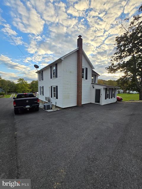 14352 Charmian Rd, Waynesboro, PA 17268 - view of side of property with a chimney and cooling unit