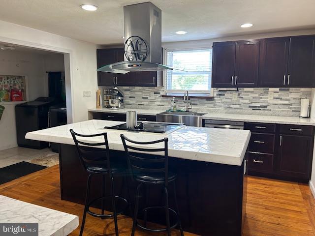 14352 Charmian Rd, Waynesboro, PA 17268 - kitchen featuring light countertops, black electric cooktop, and island exhaust hood