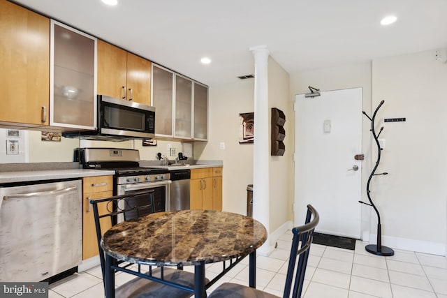 kitchen with appliances with stainless steel finishes, recessed lighting, visible vents, and light tile patterned floors