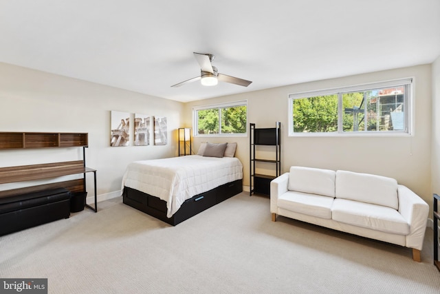 bedroom with carpet, baseboards, and a ceiling fan