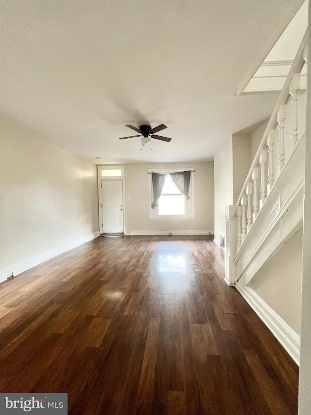 spare room featuring ceiling fan and dark hardwood / wood-style flooring