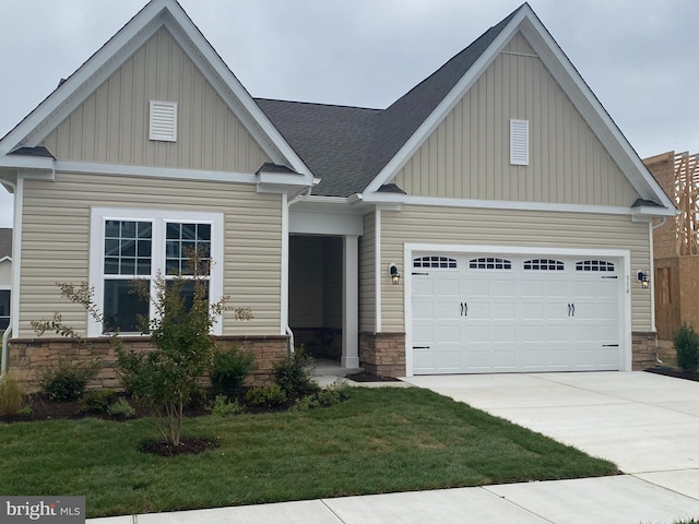 craftsman-style house with a front lawn