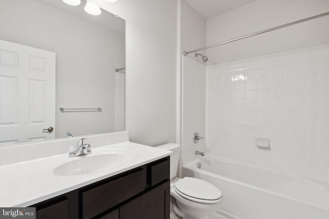 bathroom featuring toilet,  shower combination, and vanity