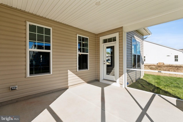 property entrance with a patio