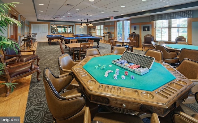 rec room with pool table, a paneled ceiling, wood finished floors, and visible vents