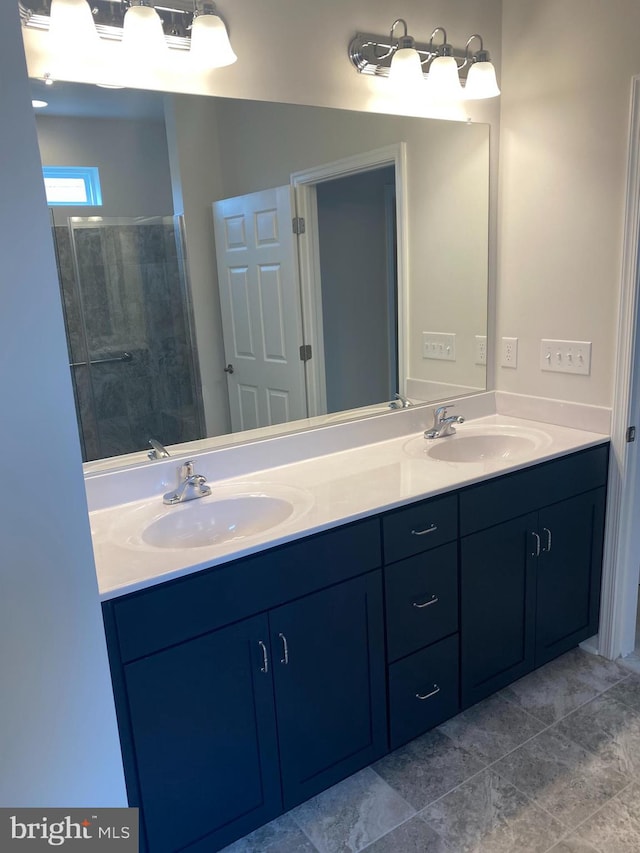 bathroom with vanity and an enclosed shower