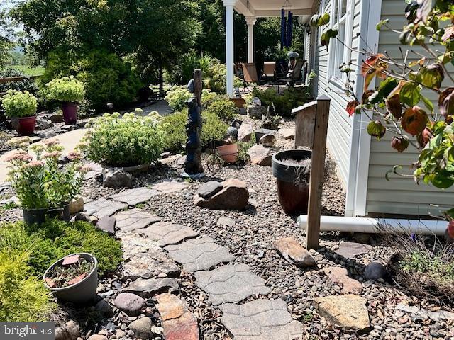 view of yard with covered porch