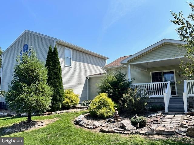 view of property exterior featuring a porch