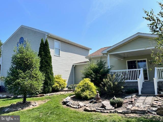 view of side of home featuring a porch