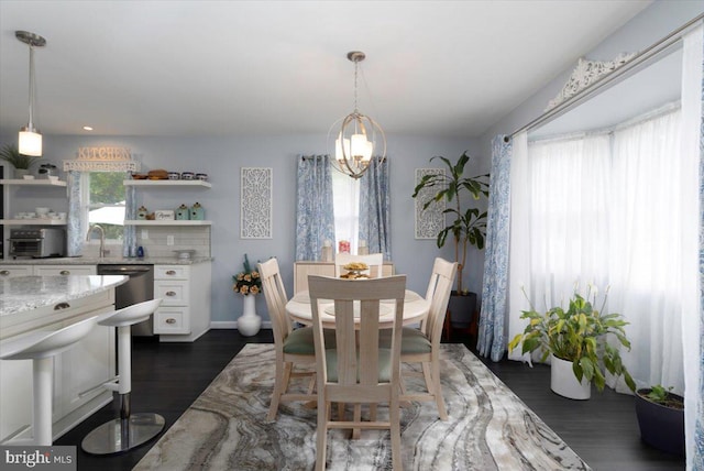 dining space with dark wood-style floors and baseboards