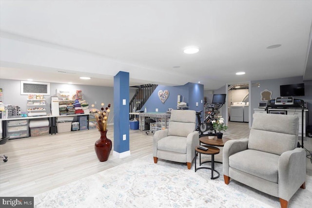 living area with stairs, washer and clothes dryer, wood finished floors, and recessed lighting