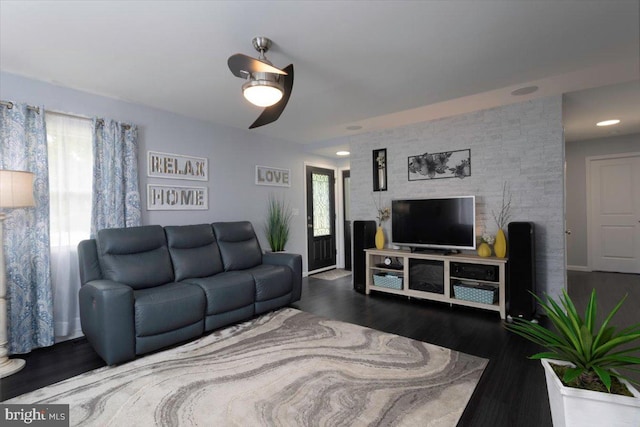 living area with wood finished floors and baseboards