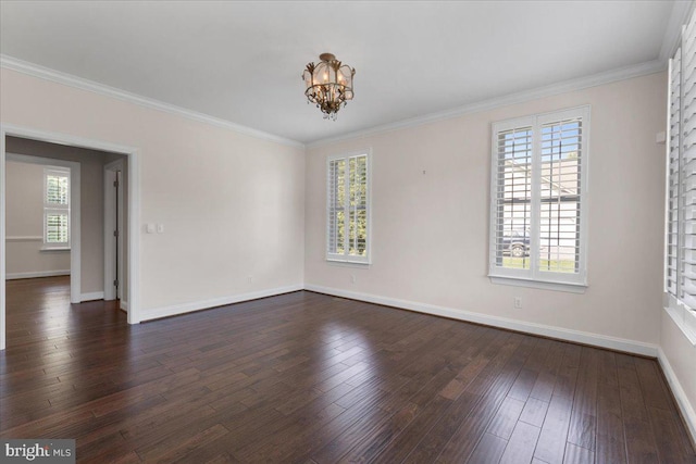 empty room featuring a notable chandelier, plenty of natural light, and dark hardwood / wood-style flooring