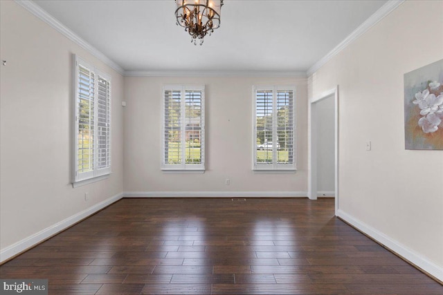 unfurnished room featuring crown molding, dark hardwood / wood-style floors, and an inviting chandelier