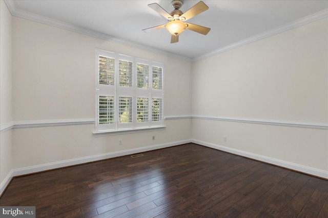 empty room with ornamental molding, ceiling fan, and dark wood-type flooring