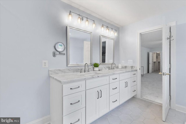 bathroom with tile patterned flooring and vanity