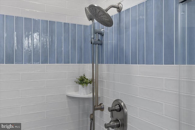 bathroom with a tile shower