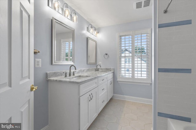 bathroom with vanity and tile patterned floors