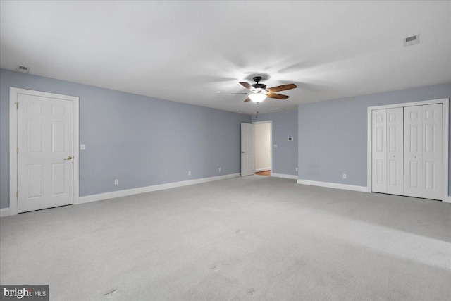 unfurnished bedroom featuring carpet flooring and ceiling fan