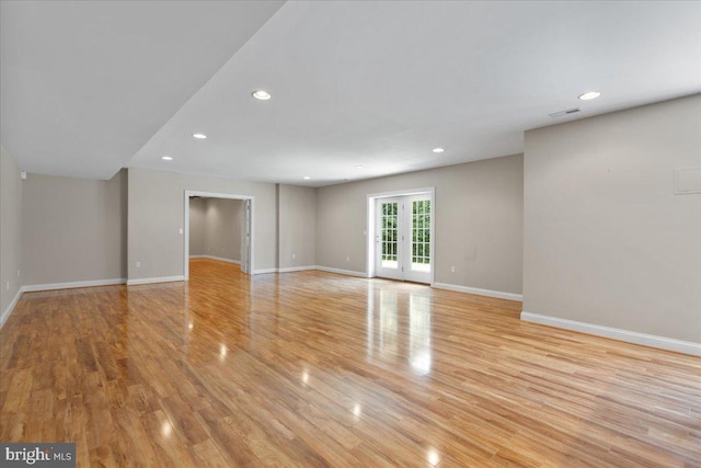 spare room featuring light hardwood / wood-style flooring